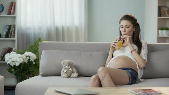 Mother-To-Be Drinking Juice, Healthy Eating and Nutrition Over Pregnancy Vitamin