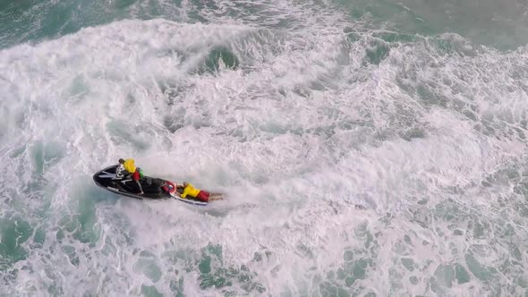 Aerial view of lifeguard surf rescue jet ski personal watercraft in Hawaii