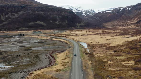 Drone Tracking Car Driving By Fjord