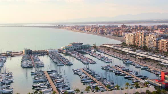 Puerto Santa Pola, Alicante, Spain. Boats And Yachts In Maritime Docks During Sunset.