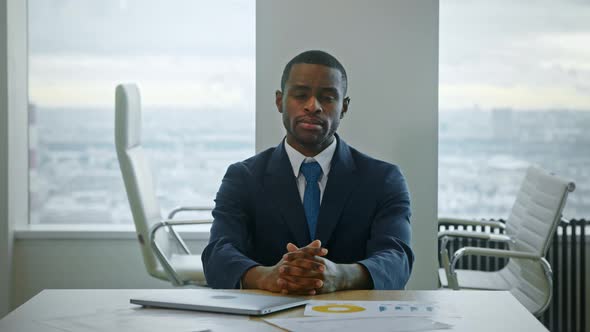 Young african american businessman looking at camera
