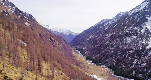 Aerial Flying Moving Side Over Snowy Mountain Yellow Valley Fall Establisher