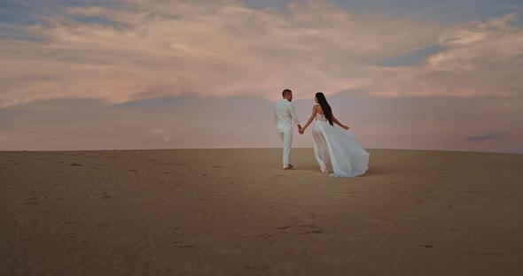 Lady Walking Through the Sand on the Beach They