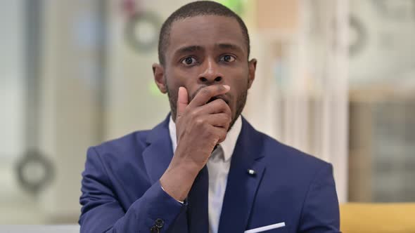 Portrait of Upset African Businessman Feeling Shocked 