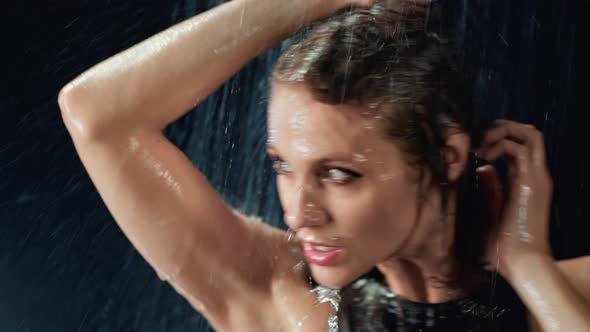 Seductive Fashion Lady Dancing Under Water Drops Touching Wet Face and Body