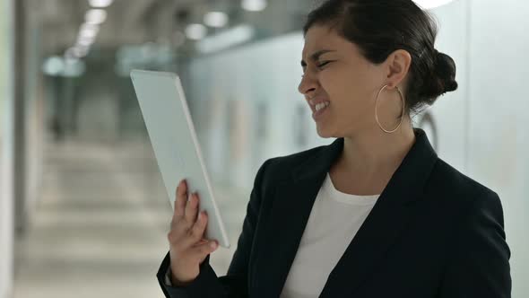 Upset Indian Businesswoman Having Loss on Tablet