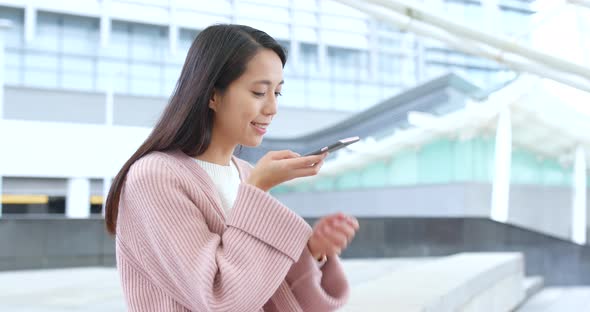 Woman using mobile phone at outdoor