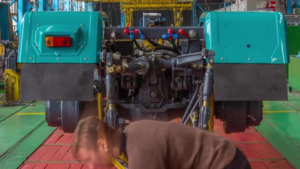 Conveyor Assembly Stage the Body of Tractor at Big Industrial Factory Timelapse