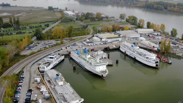 Aerial View Of BC Ferries Parked At The Deas Pacific Marine Along Fraser River In Richmond, BC, Cana
