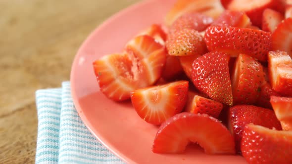 Close-up of strawberries slices in plate