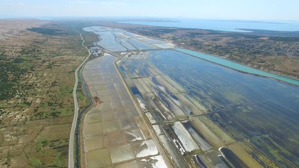 Aerial view of salt pans surrounded by sea and mountains, Pag island, Croatia