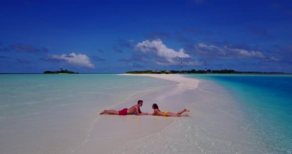 Young people on romantic honeymoon enjoy luxury on beach on white sand background 4K
