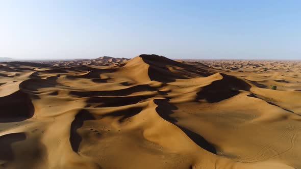 Aerial view of strong shadows created by desert landscape, U.A.E.