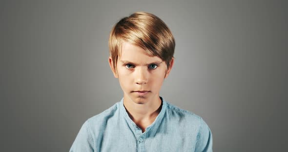 Serious Boy Isolated on Background