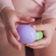 Purple and Green Egg in the Hands of a Child - VideoHive Item for Sale