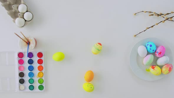 Easter Eggs Colors and Willow Branches on Table