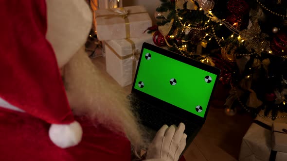 Modern Santa Claus Greets Talks Online Webcam Video Call Laptop Green Screen