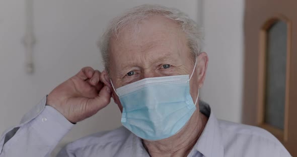 An Elderly, Cured Man Removes a Medical Mask and Genuinely Rejoices at Camera