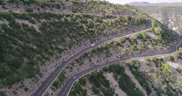 Aerial Drone View of Cars Passing Through Curve Roads on Serpentines in France