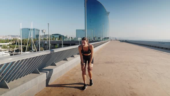 Sportswoman Checking Smart Watch After Run