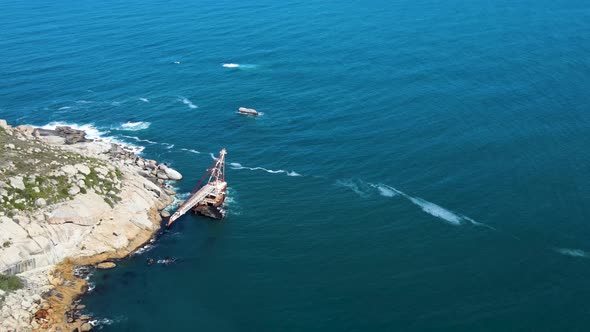 Aerial view of shipwreck crane barge is off the coast of Sandy Bay.