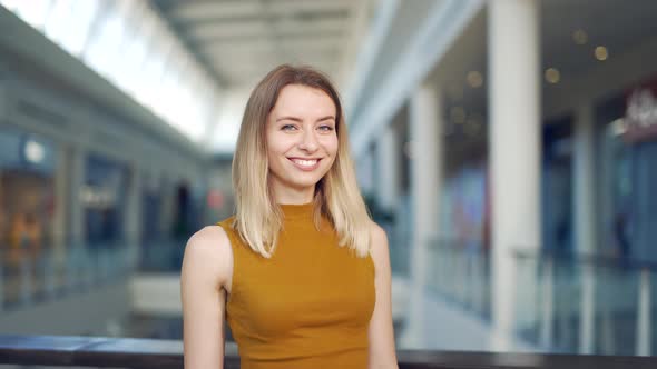 Close-up portrait happy young woman in casual clothes looking at camera and smiling. 