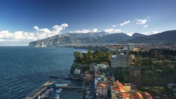 Sorrento, Italy. View of the Town and Evergreen Flora Park on Coast of Tyrrhenian Sea. Cloudy Sky