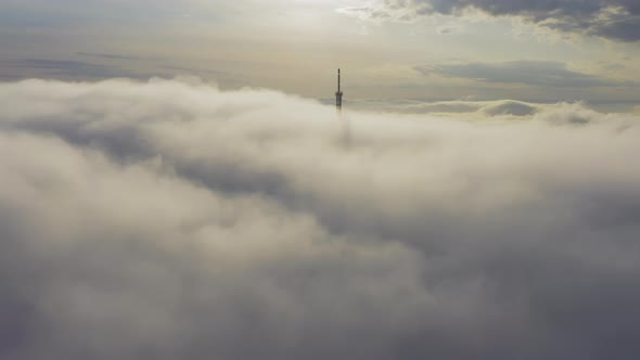 Aerial View of the Upper Part of the Broadcasting Tower in the Fog