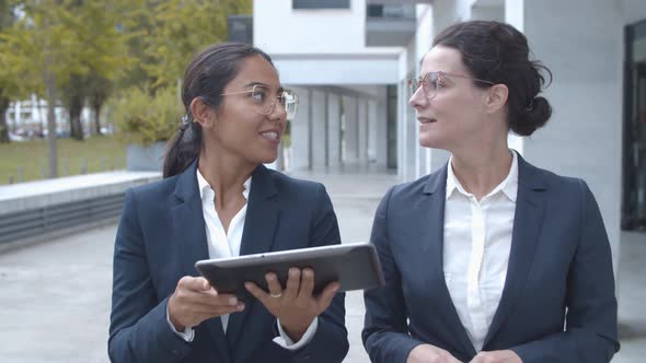 Happy Confident Female Managers Discussing Projects