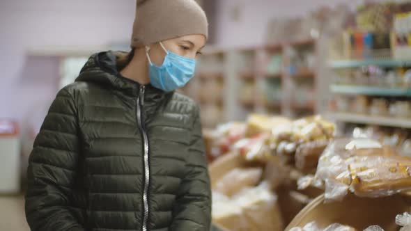 Woman in Medical Mask at the Supermarket