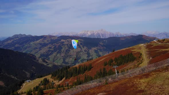 Paraglider Taking Off At The Famous Mountain Summit Of Schmitten In Kaprun, Austria. aerial