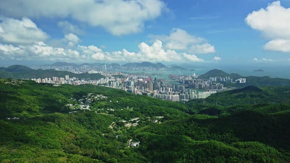 A dynamic aerial footage from the mountains showcasing the beautiful cityscape of Tseung Kwan O New