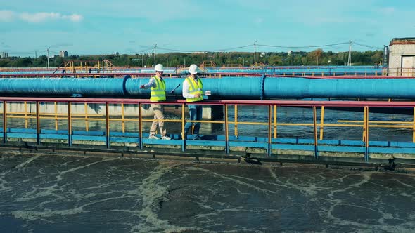 Inspectors Are Walking Along the Sewage Treatment Plant