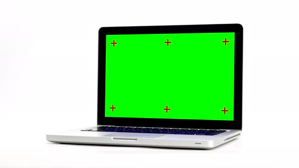 Stop motion animation green screen laptop computer turning isolated on white background.