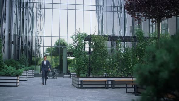 Confident Businessman Walking Business Center Garden Alone