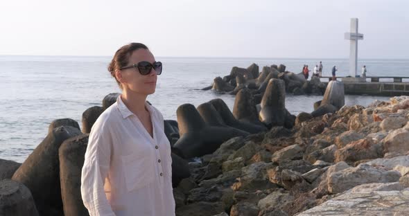 Woman on Rocky Shore