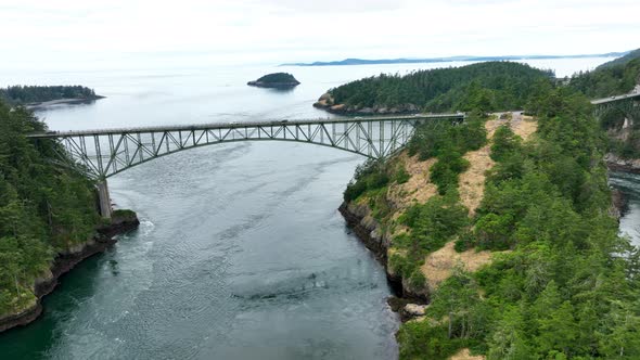 Wide drone shot of the steel bridge at Deception Pass in Washington State.