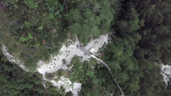 Aerial top view of Sugana Valley, with drone rotating while ascending