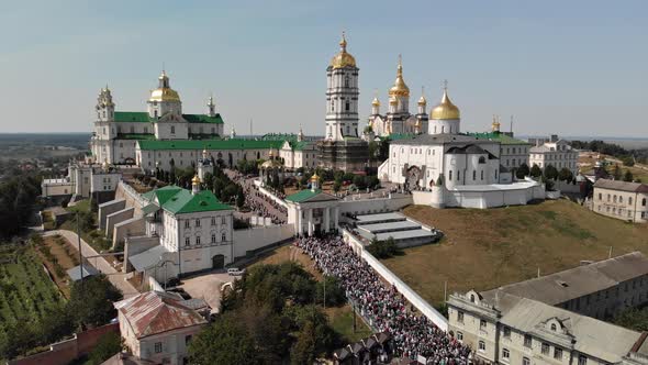 Top view of the Pochaev Lavra at the moment when a lot of people enter it.
