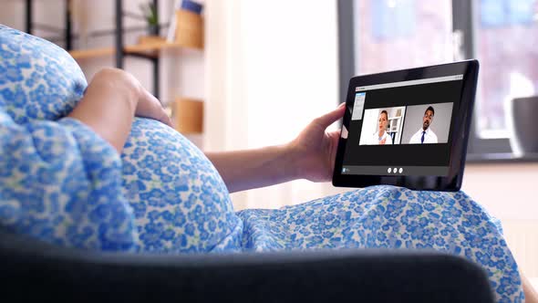 Pregnant Woman Having Video Call with Doctors