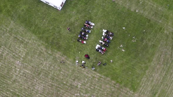 Overhead view of an outdoor wedding ceremony in a grassy field,Czechia.