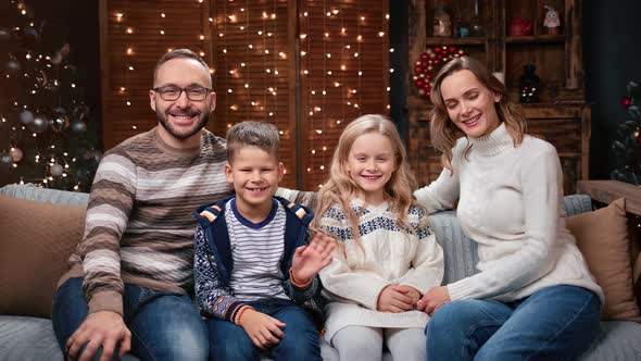 Joyful Family Laughing Enjoying Evening Christmas Eve at Home