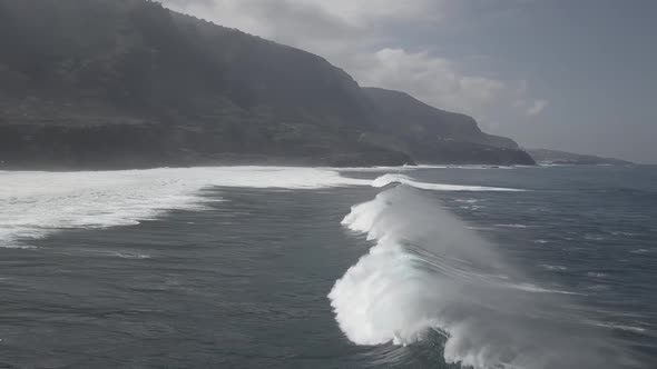 Stormy sea waving on rocky coast