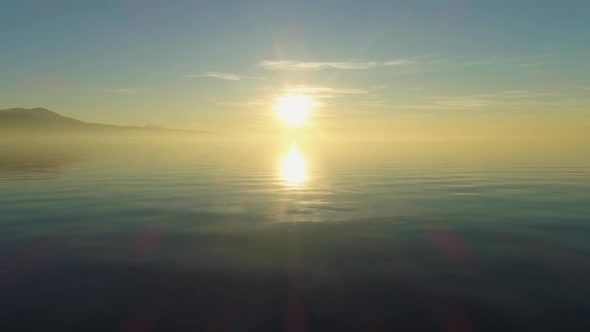 Lake Geneva at Colorful Sunset. Sun Reflection. Switzerland. Aerial Shot