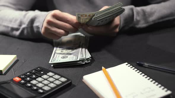 Woman Counting Dollars Money