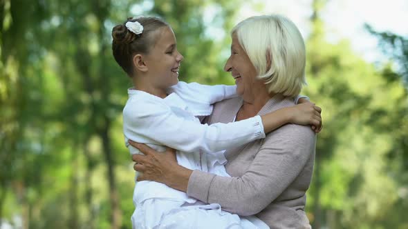 Beloved Granddaughter Sitting on Grandmothers Laps, Trusting Relations, Family