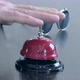 A man's hand rings a bell at the front desk. - VideoHive Item for Sale