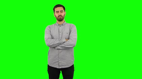 Brunette Guy Is Listening To Information, Shocked and Very Upset . Green Screen