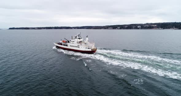 Aerial shot of a ferry in the bay of Penobscot Maine