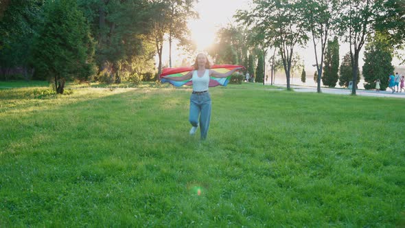 Woman Running with Rainbow Flag, Showing Tolerance.